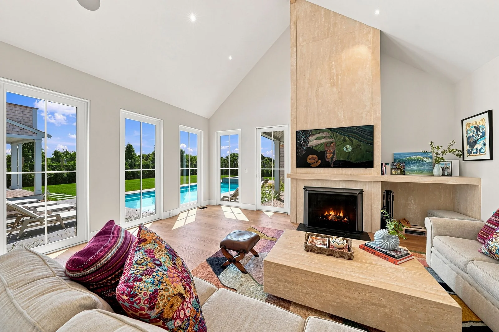 Vaulted living room with travertine fireplace