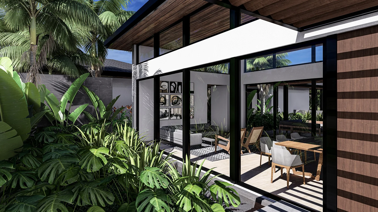Living room opening onto the courtyard through glass walls